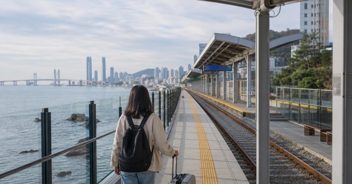 Photorealistic Busan coastal public transit walkway with a traveler and suitcase for a car-free weekend route