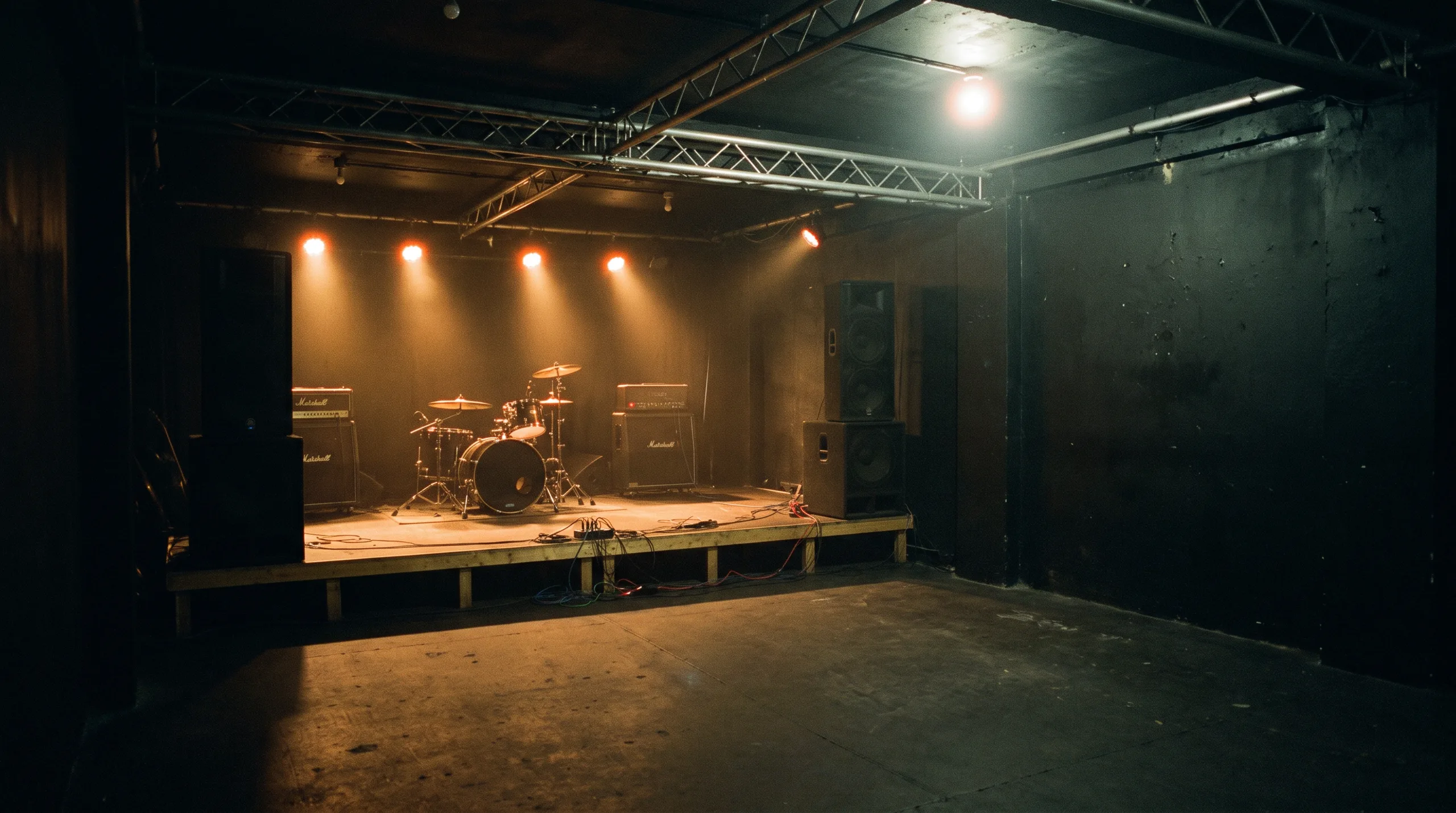 The empty stage at The Room, lit and set up before doors